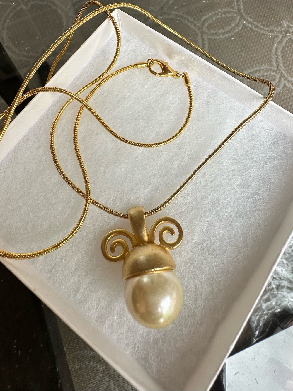 Vintage gold tone scrollwork pendant necklace with large faux pearl